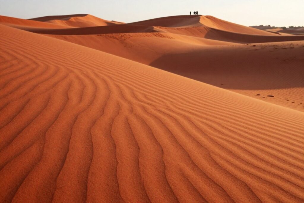 Red sand dunes near Mui Ne beach with orange and crimson colored sand formations