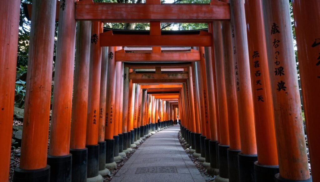 Vermillion torii gates creating tunnel at Fushimi Inari Shrine Vermillion torii gates creating tunnel at Fushimi Inari Shrine